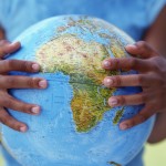 Girl's hands holding globe Girl's hands holding globe